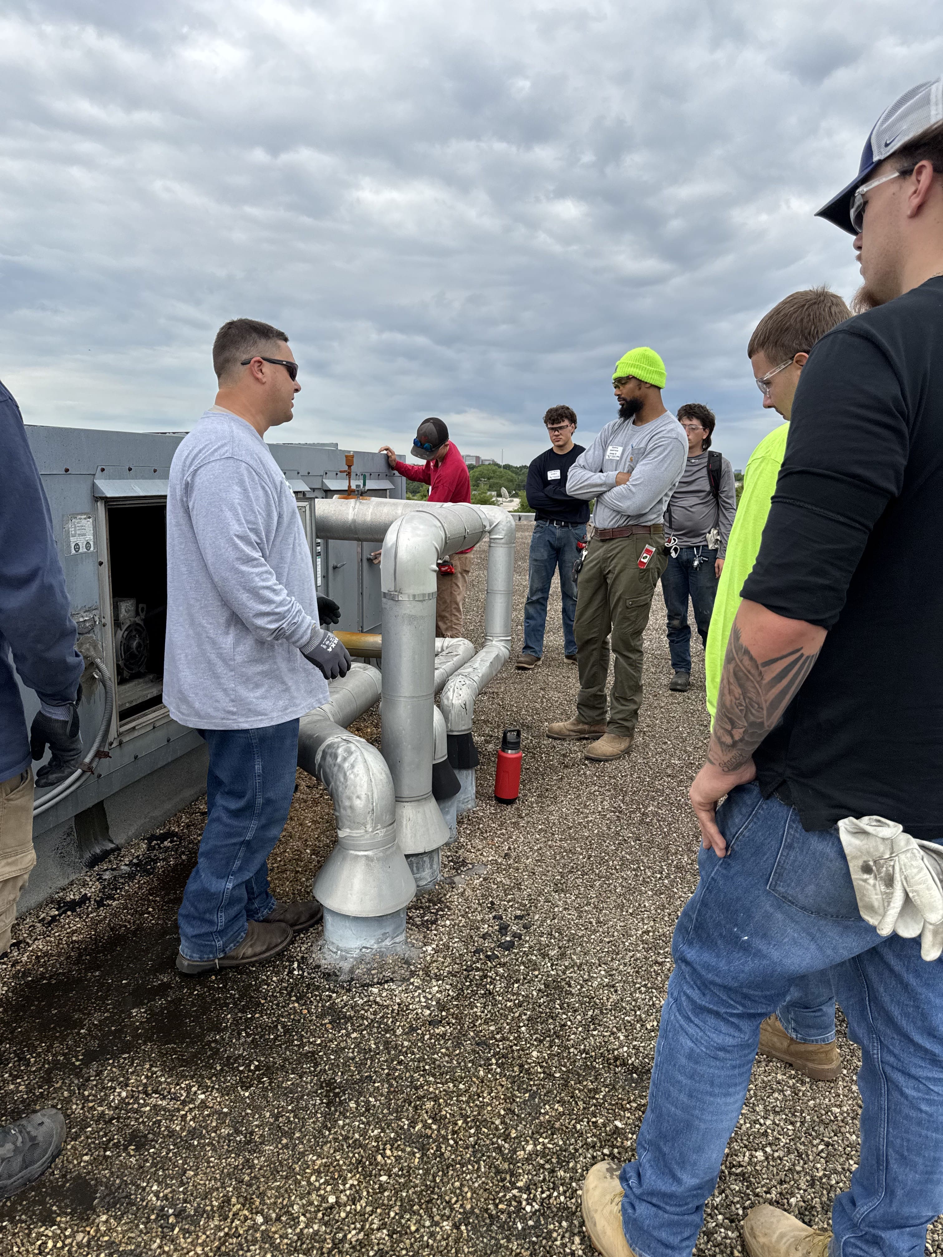 apprentices learning commercial plumbing